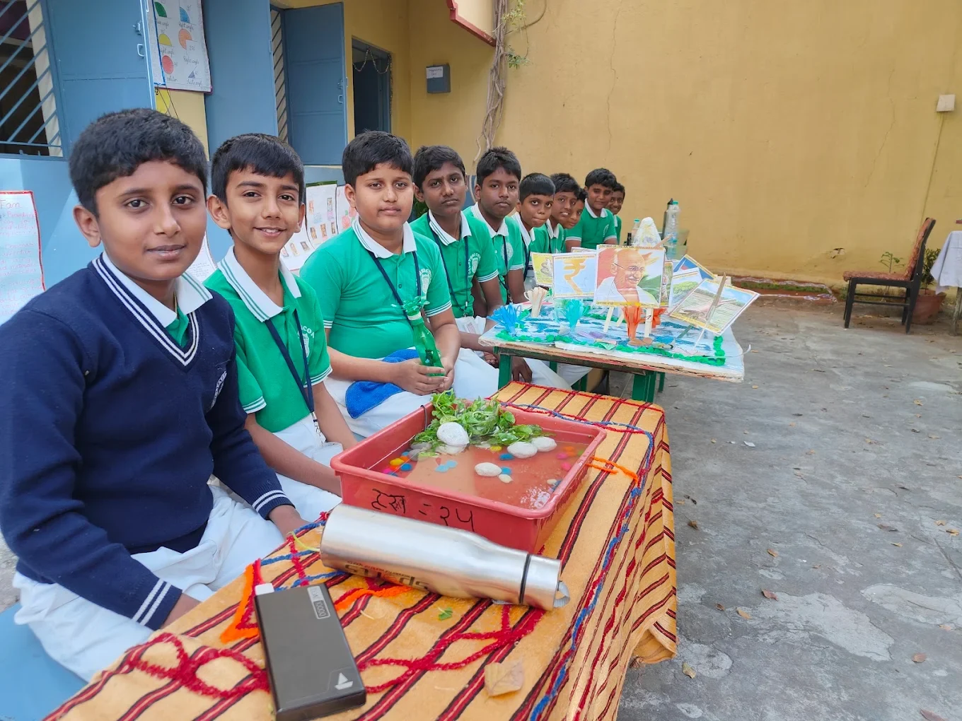 Students sharing their exhibition projects at Gayathri School, part of the Trust’s charitable work