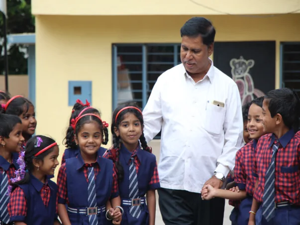 Founder Aijaz Ahmed with students at Gayathri School